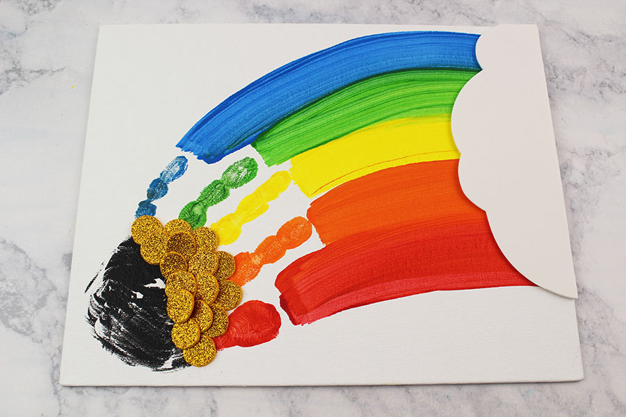 This cute and colorful handprint rainbow craft is perfect for a rainy day activity or as a fun St. Patrick's Day craft! 